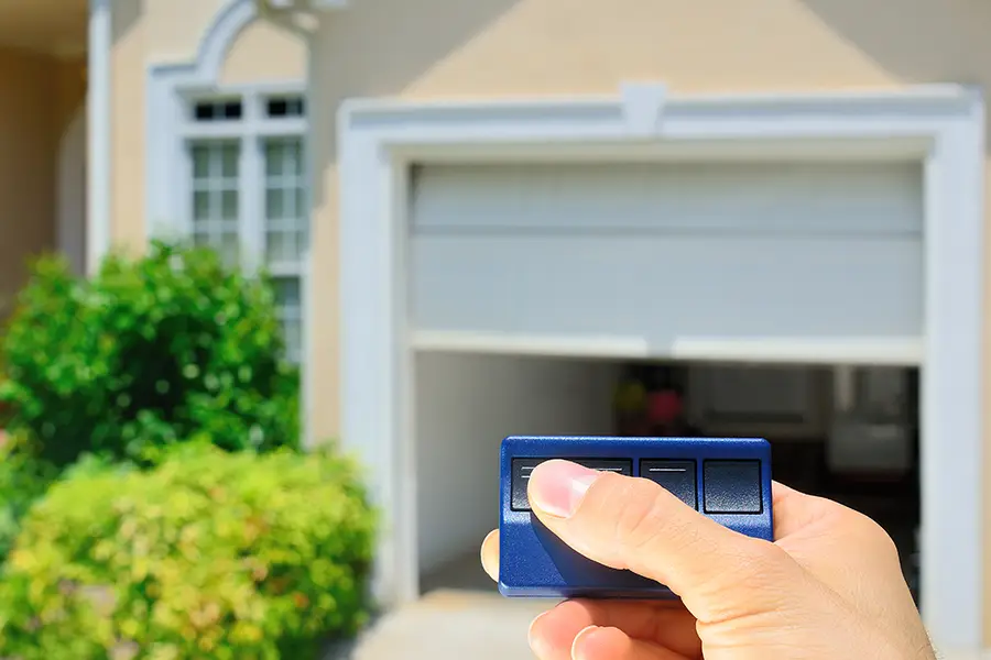 Tri County Garage Door Company - Edwardsville IL - hand holding a garage door opener