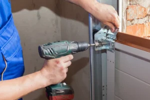 Tri County Garage Door Company—A professional technician installs a new garage door at a residential home in Edwardsville, IL.